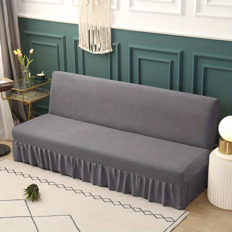 Housse de canapé extensible en velours côtelé à volants, détail de l'ourlet