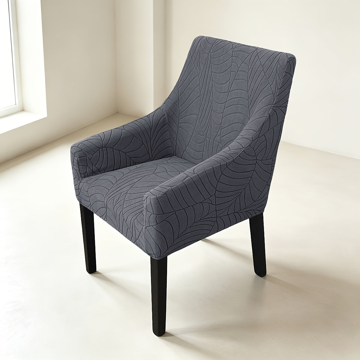 Housse de chaise extensible en velours côtelé jacquard à motif feuillage, gros plan sur le tissu