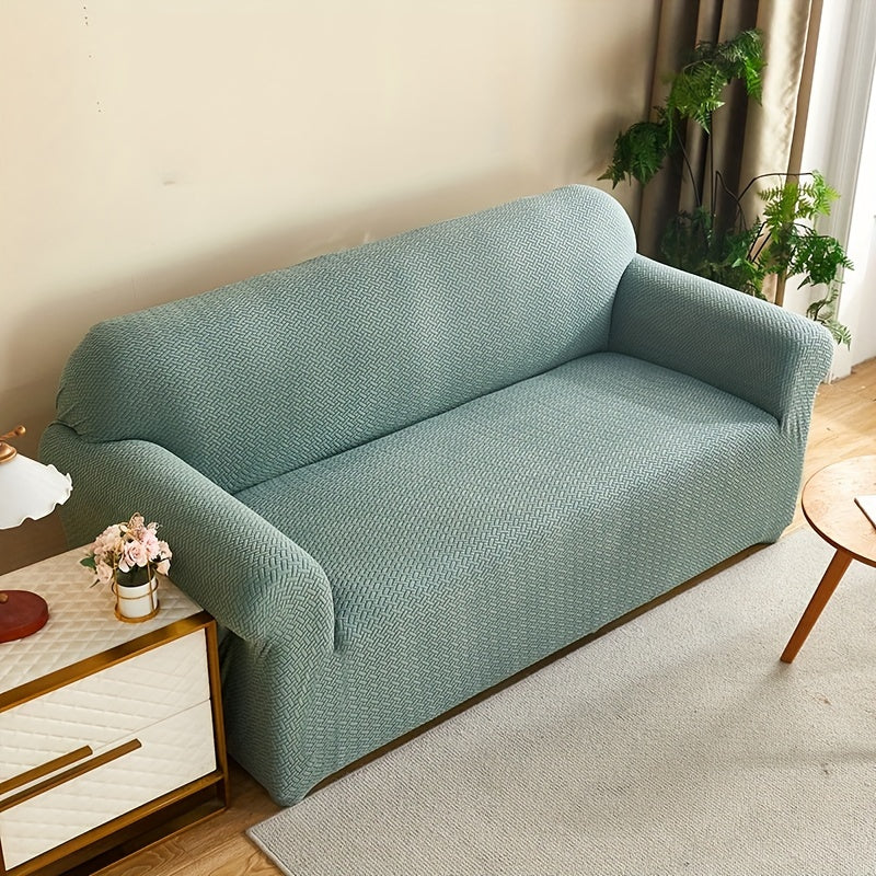 Housse de canapé extensible en polaire matelassée antidérapante, détail de l'ourlet