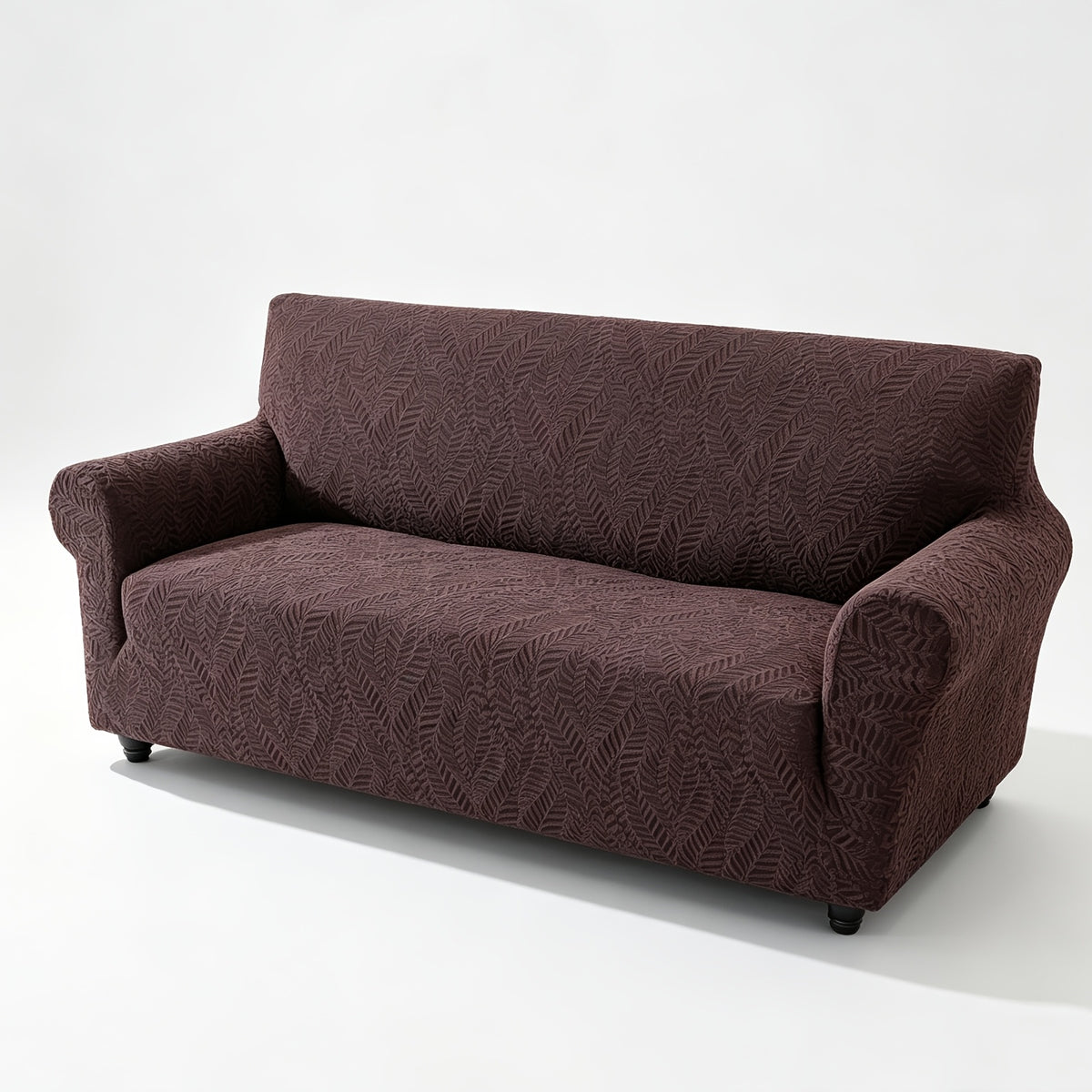 Housse de canapé extensible en polaire jacquard à motif feuillage anti-griffes, détail de l'ourlet