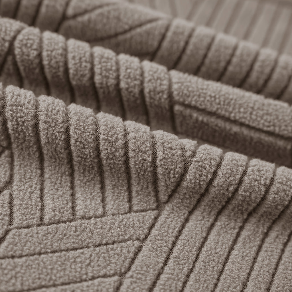 Housse de canapé extensible en velours côtelé jacquard pour fauteuil, détail de la finition