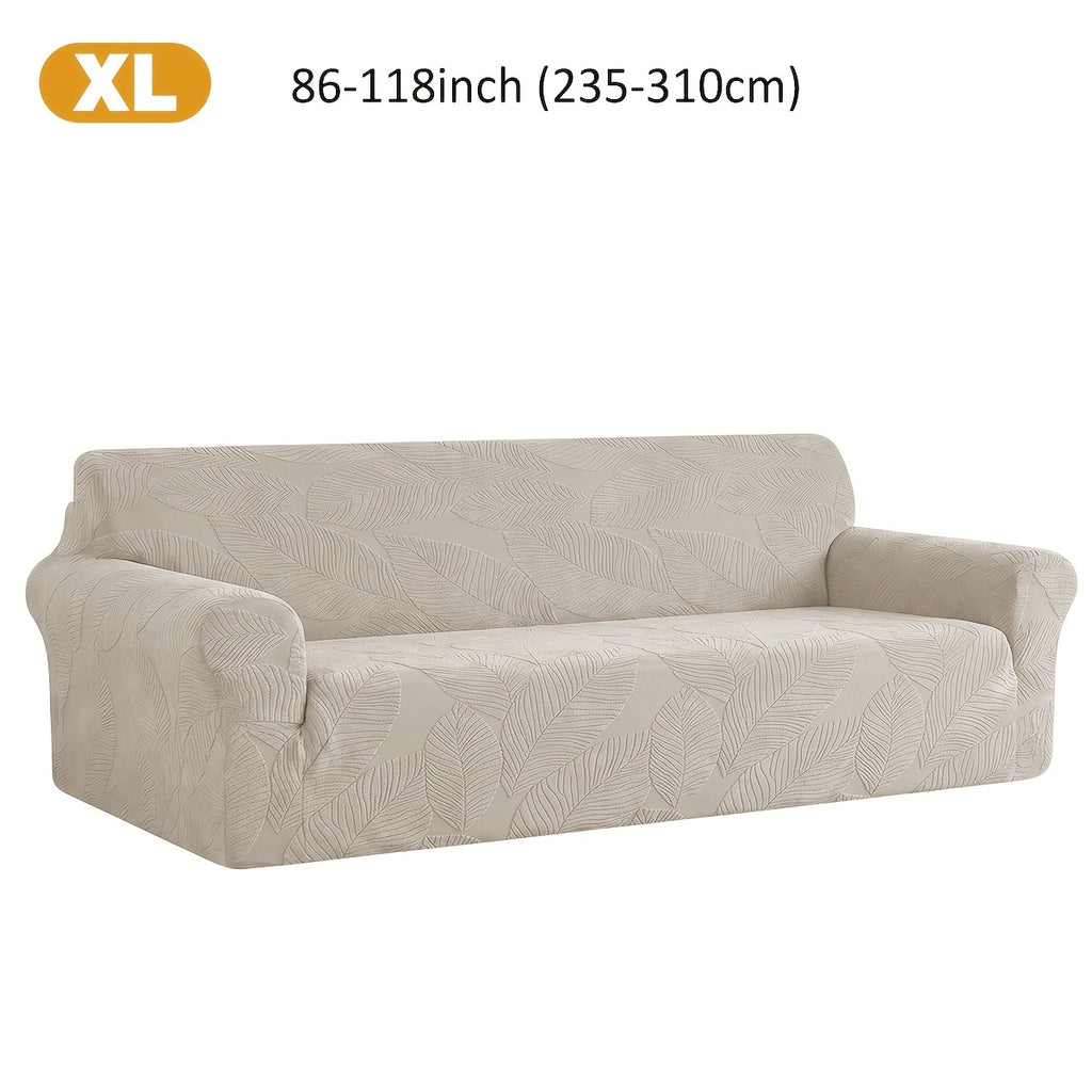 Housse de canapé extensible en polaire jacquard à motif feuillage, détail de l'ourlet