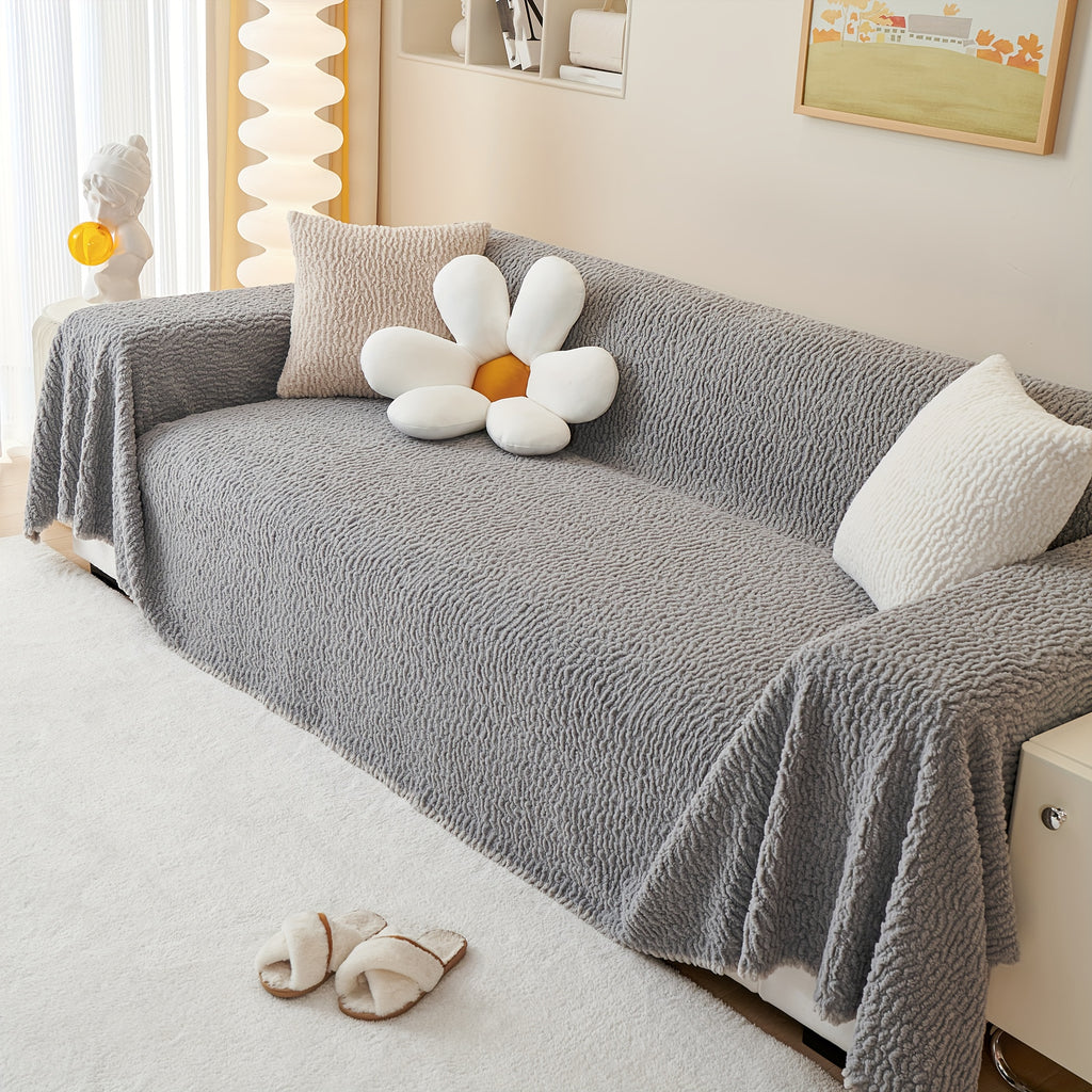 Housse de canapé en jacquard au rendu glamour, gros plan sur le tissu