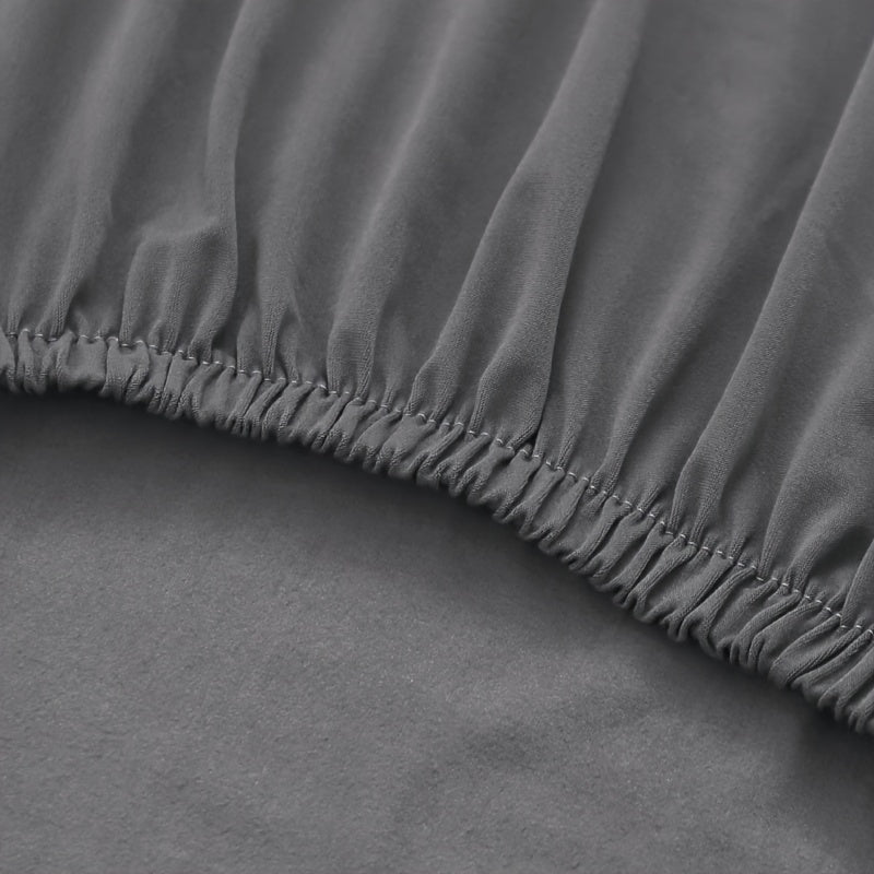 Housse de canapé extensible en fibre de lait, gros plan sur le tissu
