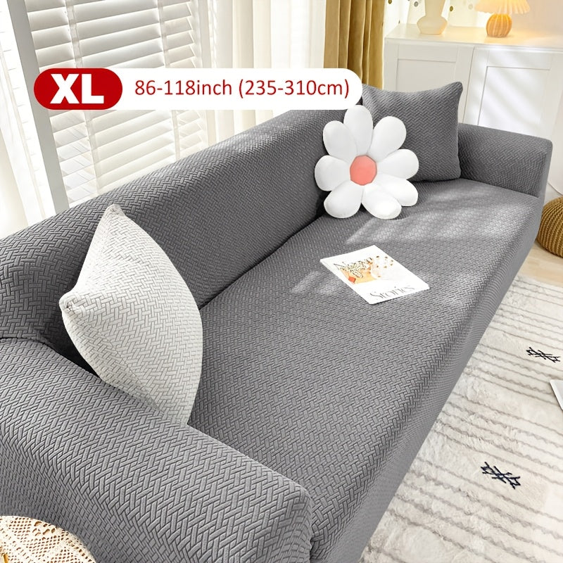 Housse de canapé extensible en velours côtelé jacquard en T, détail de l'ourlet