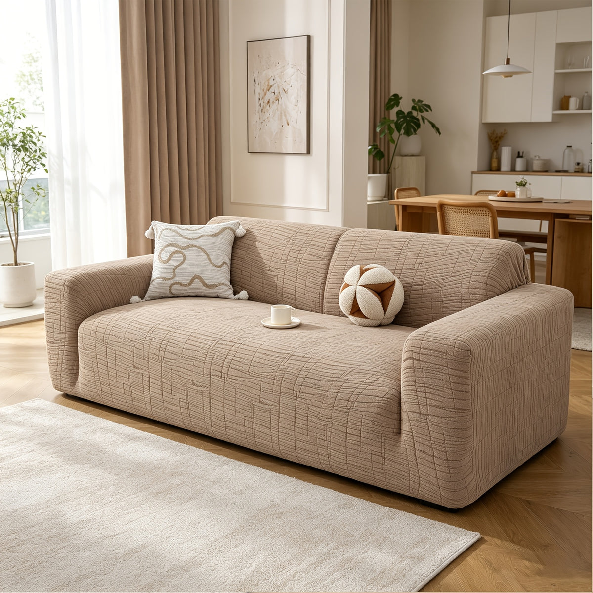 Housse de canapé extensible en polaire jacquard à motif géométrique, détail de l'ourlet