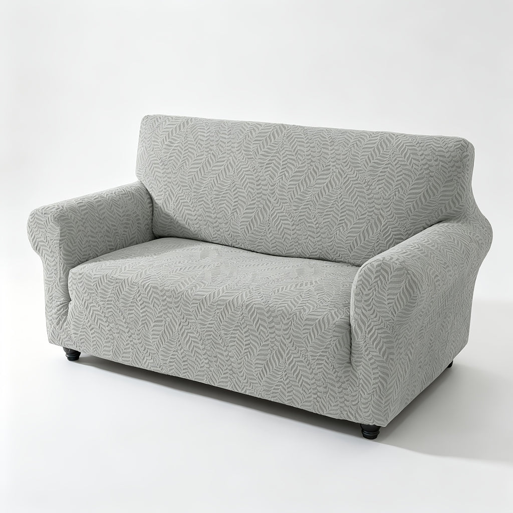 Housse de canapé extensible en polaire jacquard à motif feuillage anti-griffes, détail de la finition