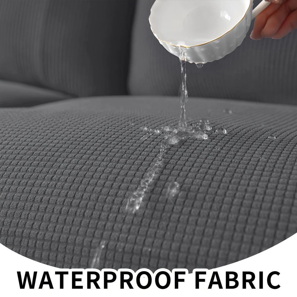 Housse de canapé extensible en polaire jacquard à carreaux sans accoudoirs, détail de l'ourlet