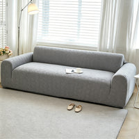 Housse de canapé extensible en polaire jacquard à rayures