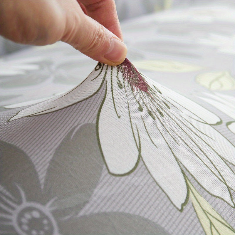 Housse de canapé extensible en fibre de lait délavée à motif fleuri, détail de la finition