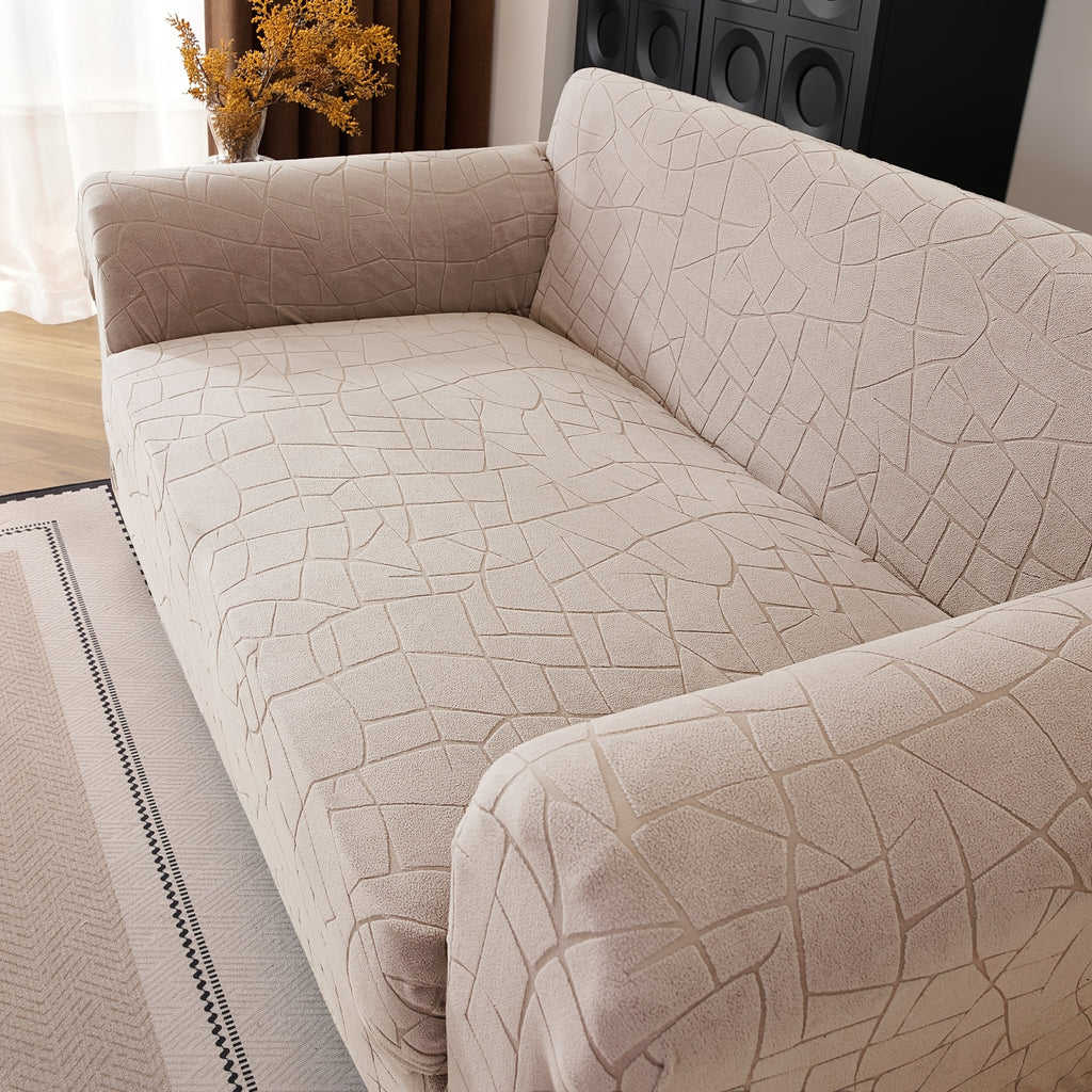 Housse de canapé extensible en polaire jacquard à motif géométrique à housses, détail de l'ourlet