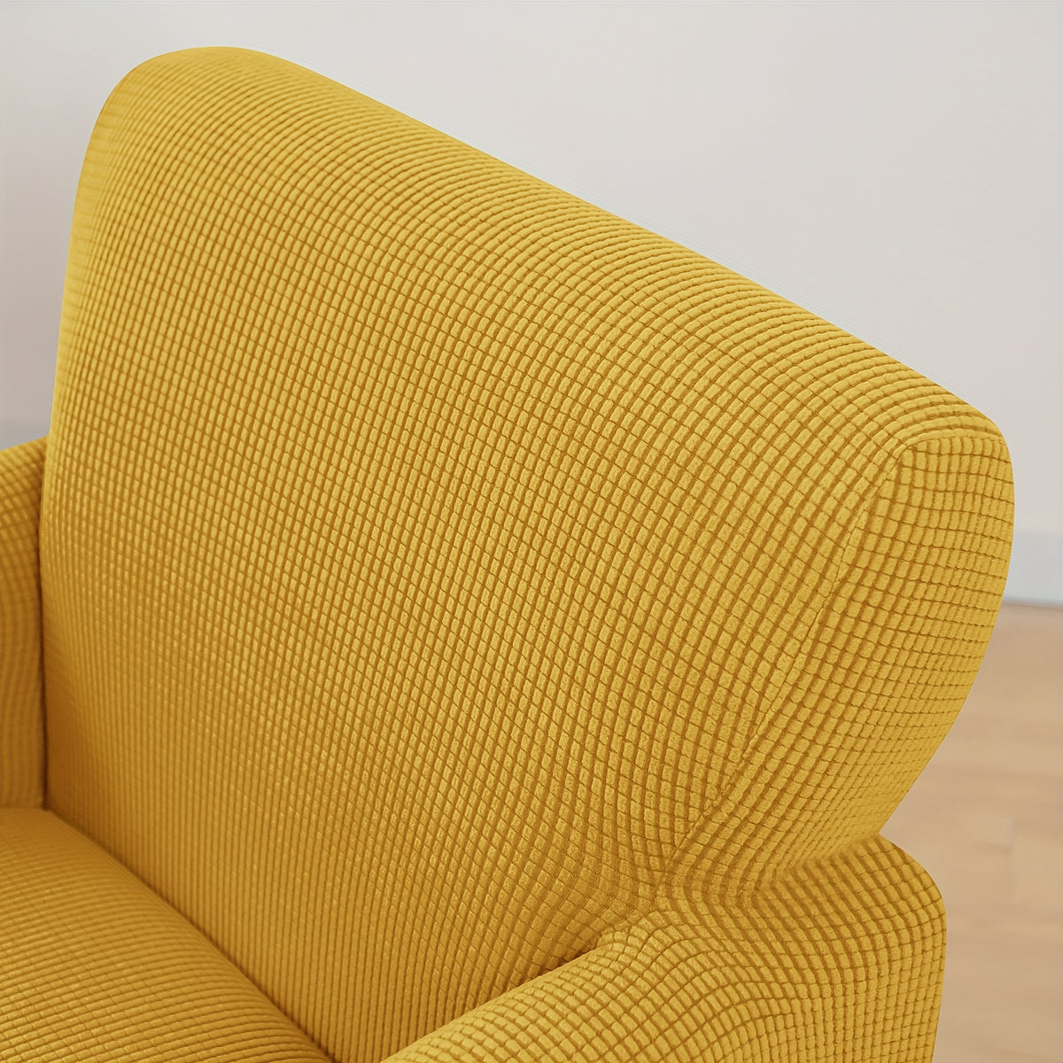 Housse de canapé extensible en velours côtelé pour fauteuil, détail de l'ourlet