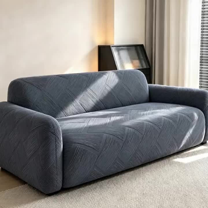 Housse de canapé extensible en polaire jacquard à rayures, vue de dos