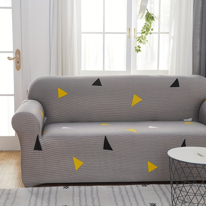 Housse de canapé extensible en fibre de lait matelassée à motif tropical, détail de l'ourlet