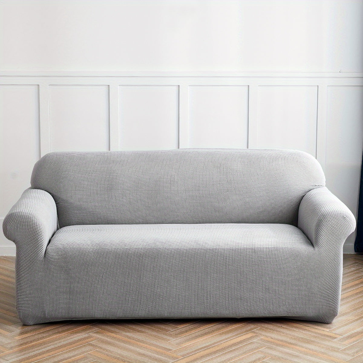 Housse de canapé extensible en polaire matelassée antidérapante, gros plan sur le tissu