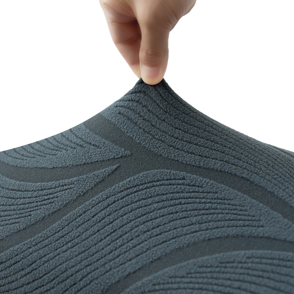 Housse de canapé extensible en polaire jacquard à motif feuillage pour canapé, détail de l'ourlet
