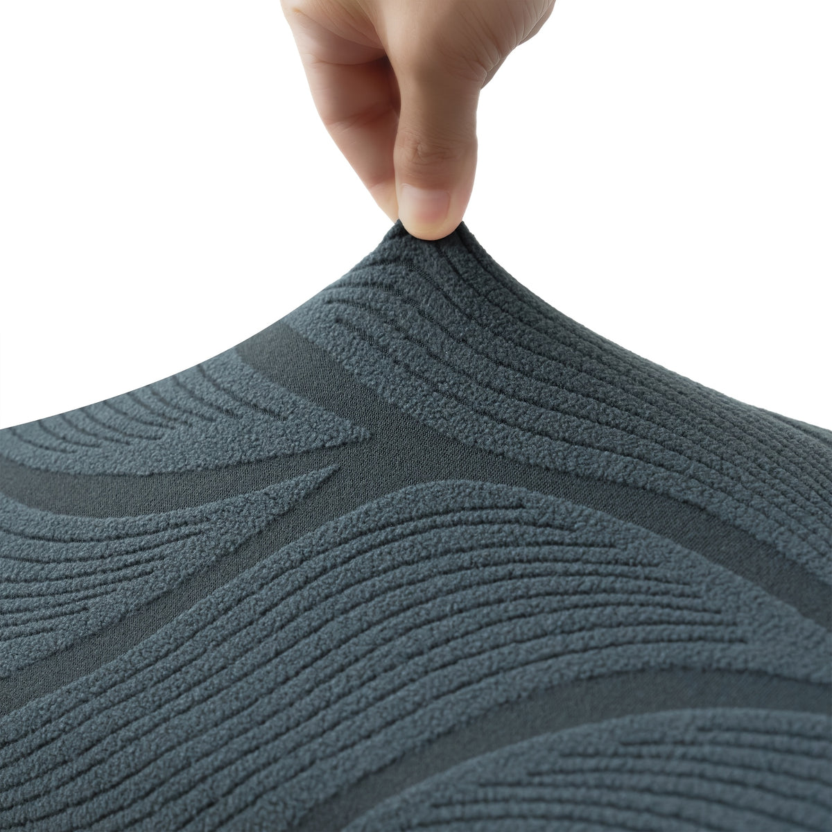Housse de canapé extensible en polaire jacquard à motif feuillage pour canapé, détail de l'ourlet
