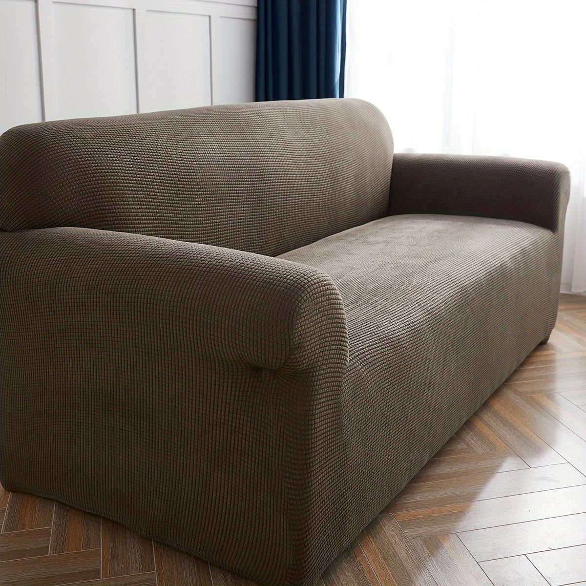 Housse de canapé extensible en polaire matelassée antidérapante, détail de la finition