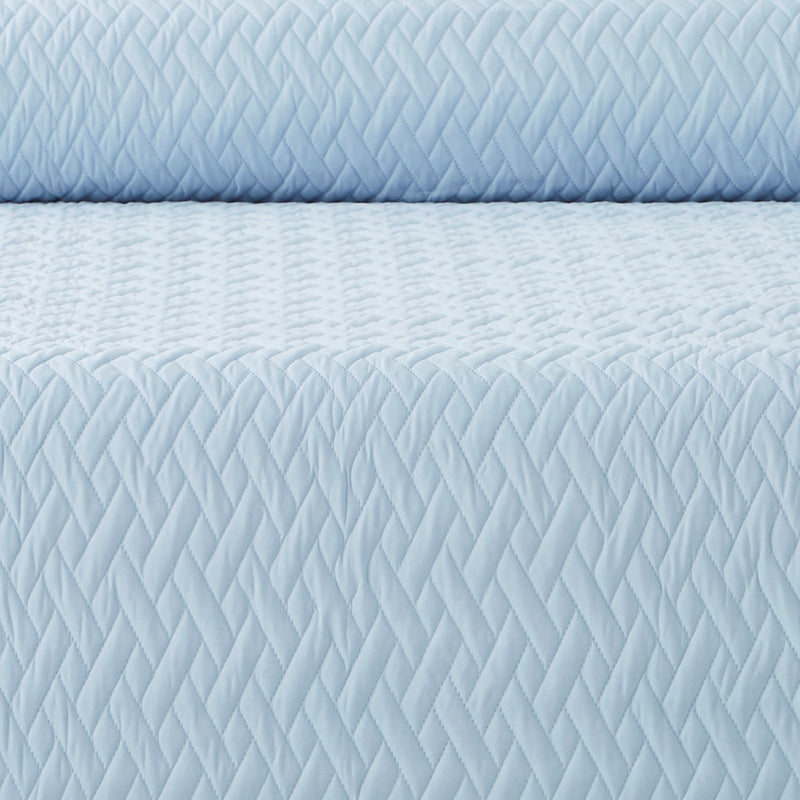 Protection de canapé en polyester matelassée — détail de la matière : polyester