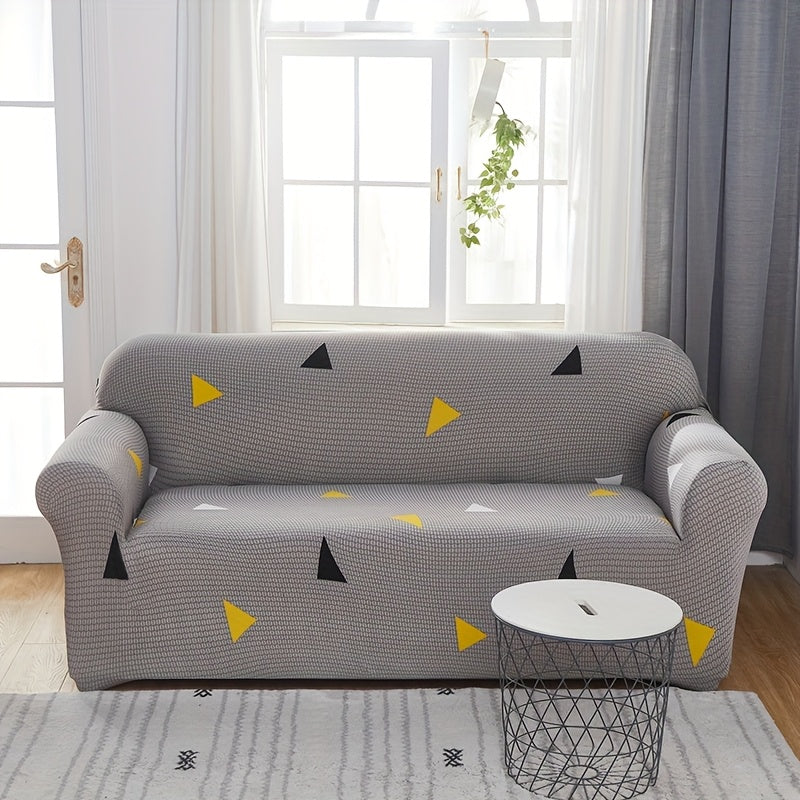 Housse de canapé extensible en fibre de lait matelassée à motif tropical, gros plan sur le tissu
