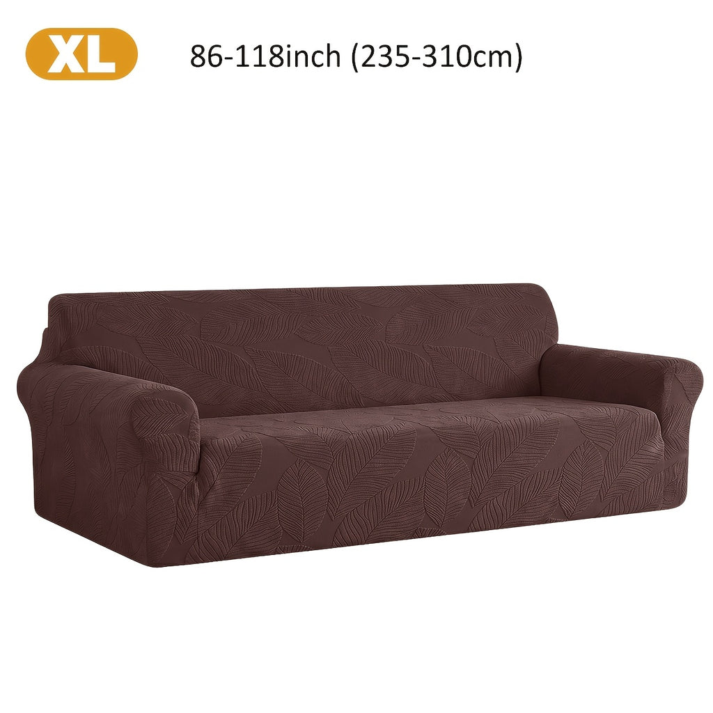 Housse de canapé extensible en polaire jacquard à motif feuillage, détail de l'ourlet