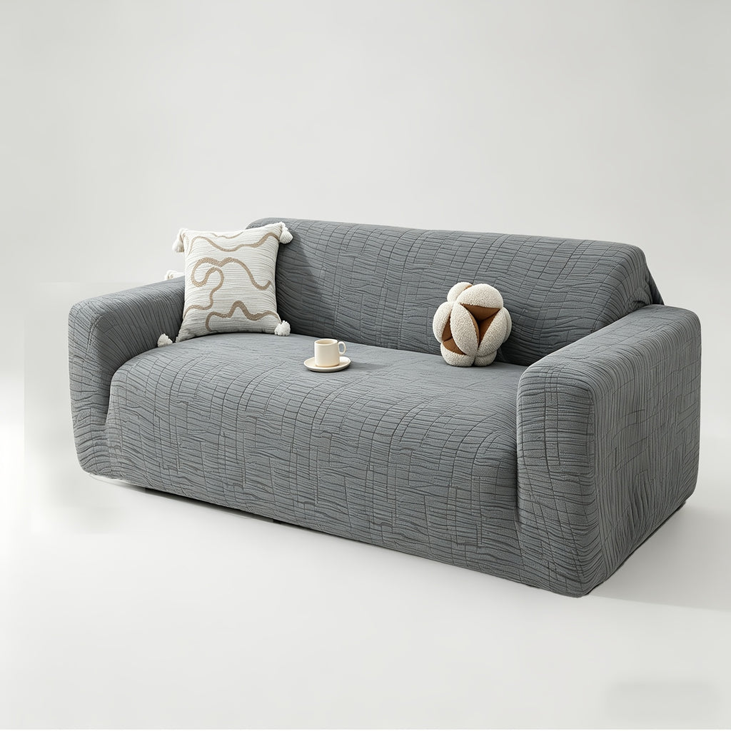 Housse de canapé extensible en polaire jacquard à motif géométrique, détail de la finition