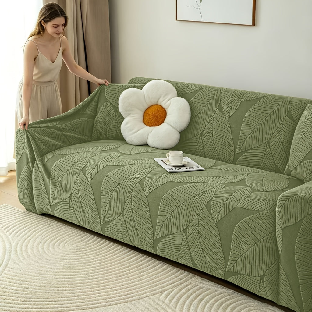 Housse de canapé extensible en polaire jacquard à motif feuillage, détail de l'ourlet