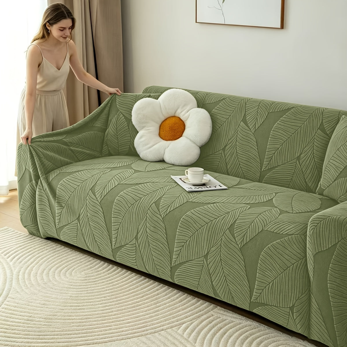 Housse de canapé extensible en polaire jacquard à motif feuillage, détail de l'ourlet