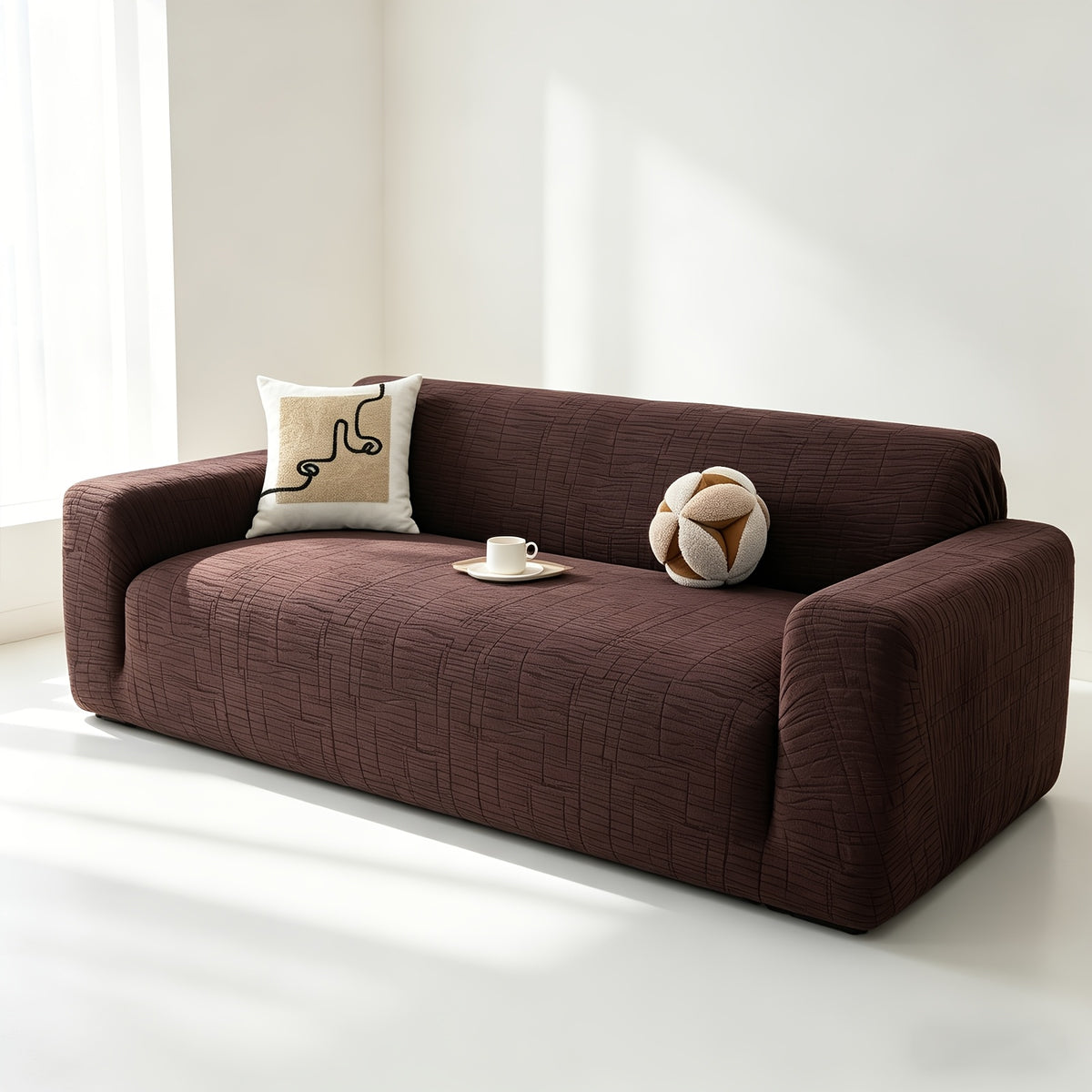 Housse de canapé extensible en polaire jacquard à motif géométrique, vue de dos